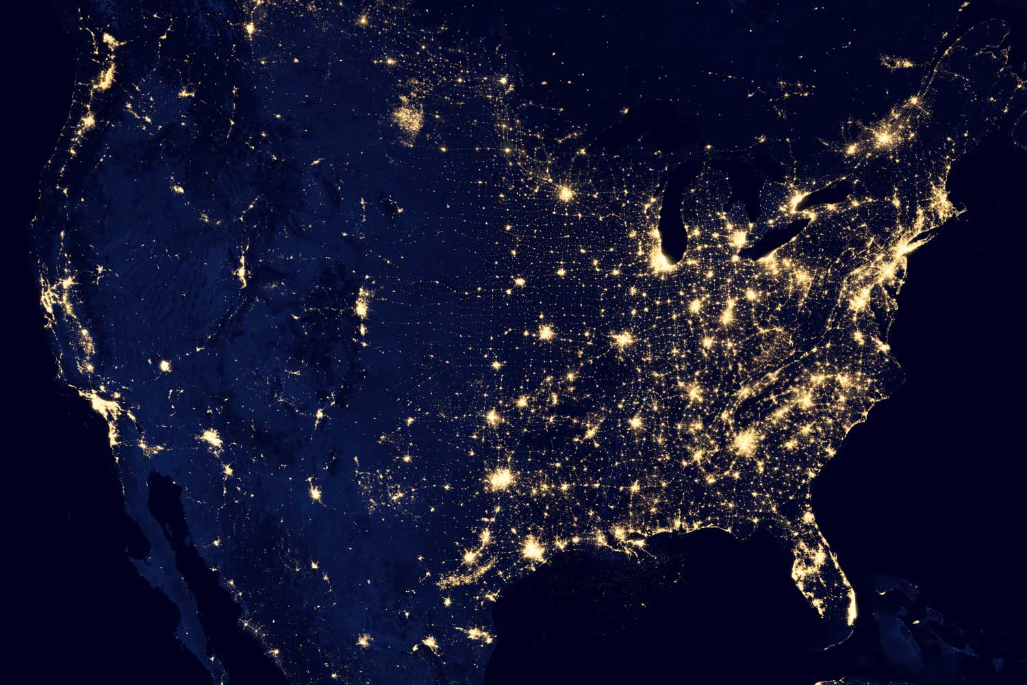 Photograph of city lights in America from space.